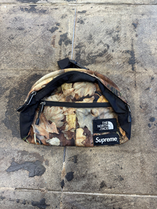 SUPREME x NORTH FACE CAMO FANNY PACK (USED)