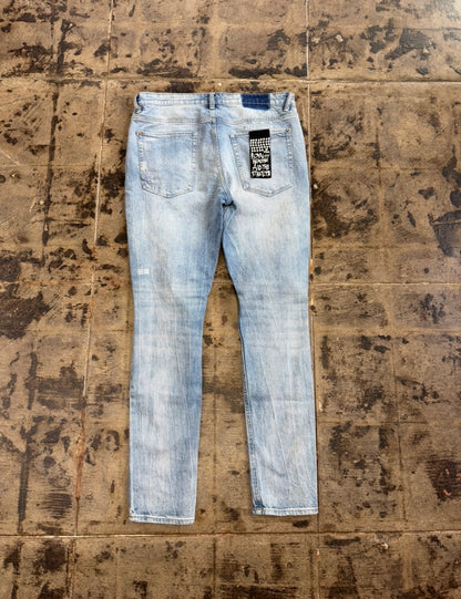 KSUBI RIPPED BLUE JEANS